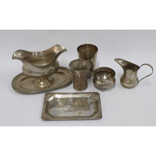 70A - A collection of Eastern and continental white metal items to include a sauce boat, beaker, small tra... 