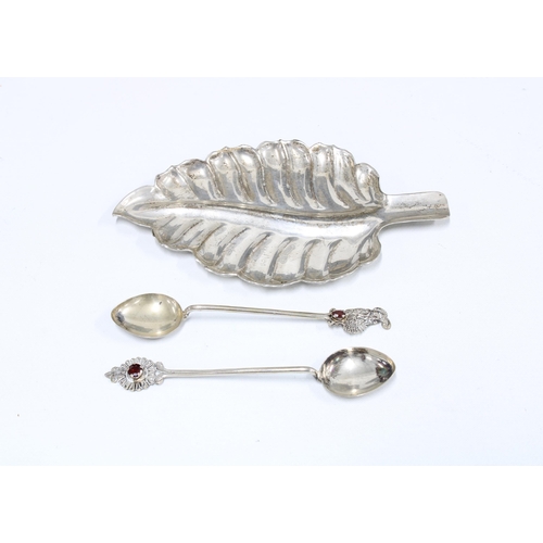 78A - Mexican silver leaf dish, 14.5cm and two white metal teaspoons, (3)