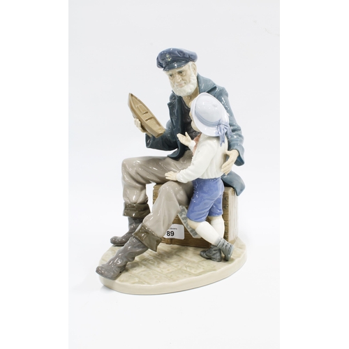 89 - Lladro figure of an old fisherman / sailor with a boy, 28cm