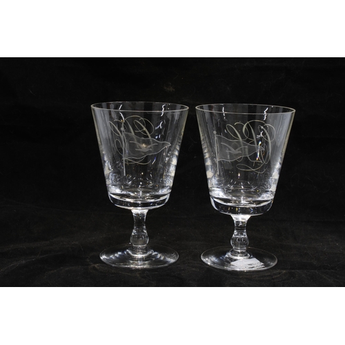 92 - A pair of etched glass rummers, the bowls with flag and bird motifs and monogrammed C B C, 13cm (2)