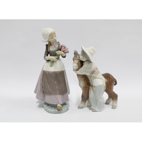 98 - Lladro figures ‘Platero and Marcelino’ No.1180 and another of a girl with flowers, taller 25cm (2)