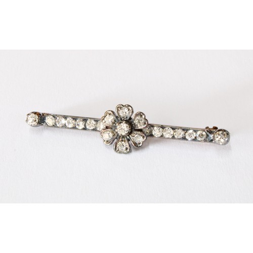 76 - Antique diamond bar brooch set in unmarked white metal with a yellow metal pin, with a central flowe... 