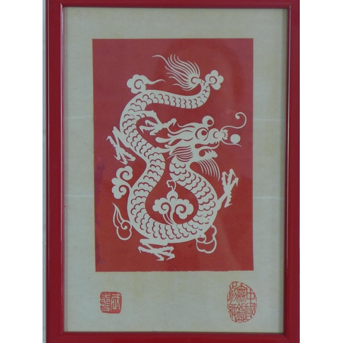 90 - Two Chinese decoupage cut outs to include a water buffalo and a dragon, framed under glass, sizes ov... 