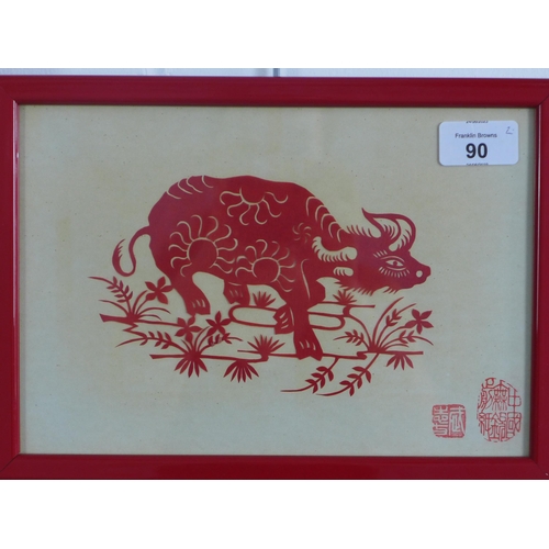 90 - Two Chinese decoupage cut outs to include a water buffalo and a dragon, framed under glass, sizes ov... 