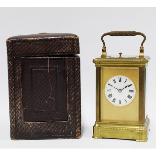1 - Brass cased repeater carriage clock with bevelled glass panels, leather case