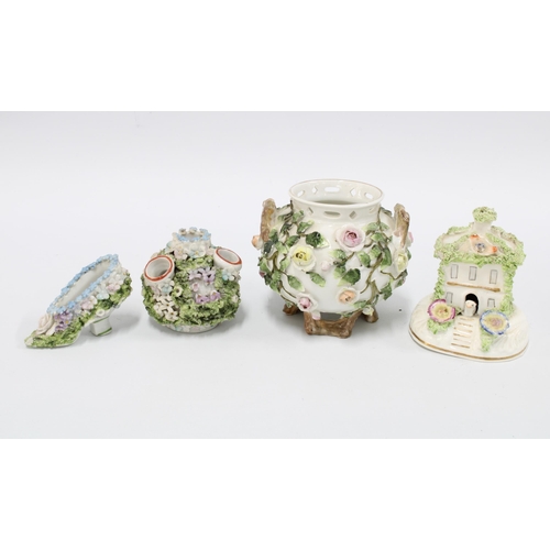 105 - Collection of small floral encrusted porcelain, to include a cottage, shoe and cauldron, etc, talles... 