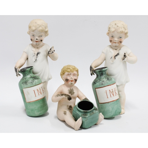 116 - Three bisque figures of children covered in ink, the two standing both a/f, 16cm (3)