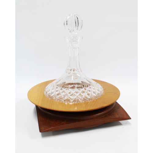 141 - Waterford crystal, cut glass ships decanter in a circular wooden base, 28cm, together with another w... 