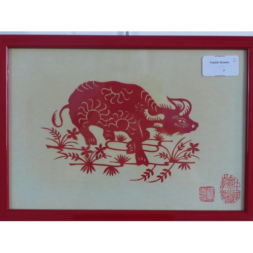 167 - Two Chinese decoupage cut outs to include a water buffalo and a dragon, framed under glass, sizes ov... 