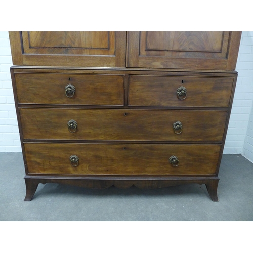 210 - Georgian flame mahogany linen press, the cornice with dentil frieze over blind fret carving and a pa... 