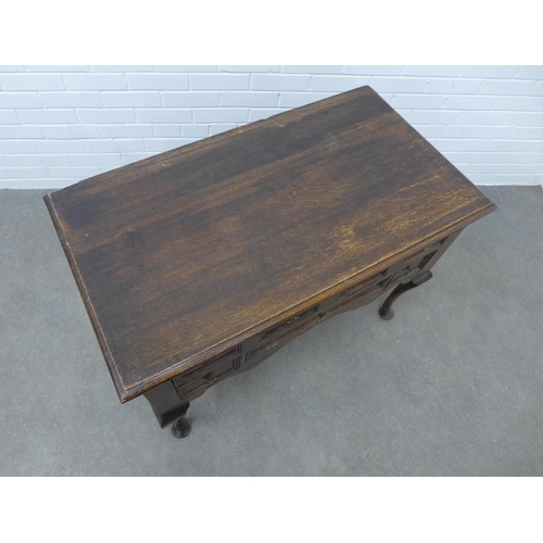 212 - An oak lowboy, rectangular top over an arrangement of six drawers, on cabriole legs, 102 x 74 x 55cm... 