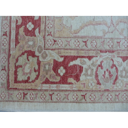 224 - Eastern carpet, beige field with terracotta floral pattern, 310 x 244cm.