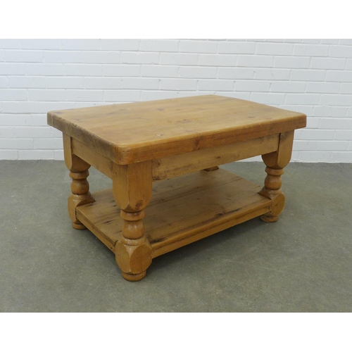 228 - Pine coffee table, rectangular top, bold legs and undertier, 90 x 50 x 60cm.