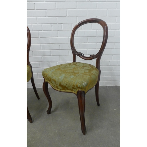 239 - Set of four Victorian rosewood balloon back chairs, 44 x 86 x 41cm. (4)