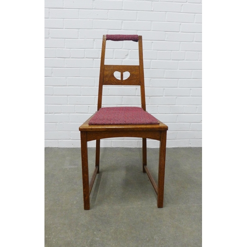 247 - An arts & craft oak chair, in the manner of Charles Rennie Mackintosh, the splat back with pierced h... 