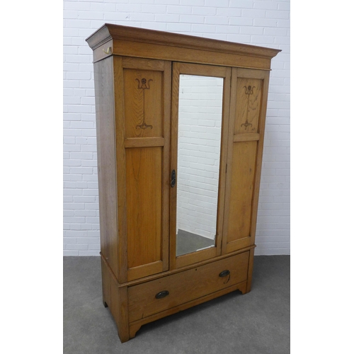 250 - An Arts & Crafts oak wardrobe, 129 x 295 x 53cm.