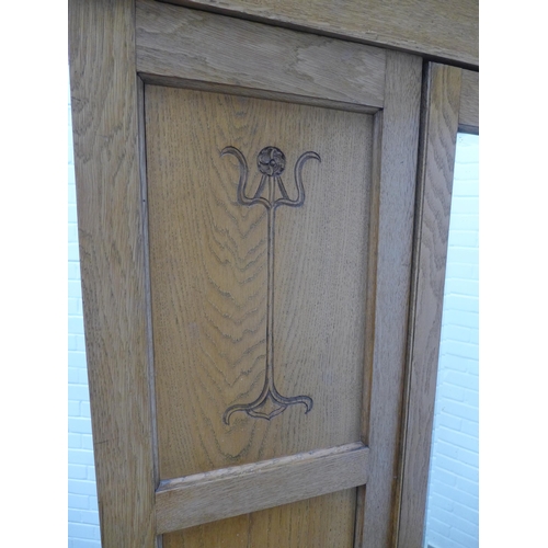 250 - An Arts & Crafts oak wardrobe, 129 x 295 x 53cm.