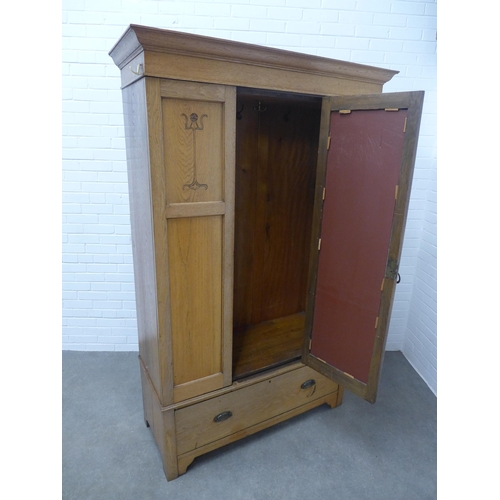 250 - An Arts & Crafts oak wardrobe, 129 x 295 x 53cm.