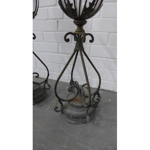 262 - Pair of glass and metal mounted urn storm lanterns, 65cm high. (2)