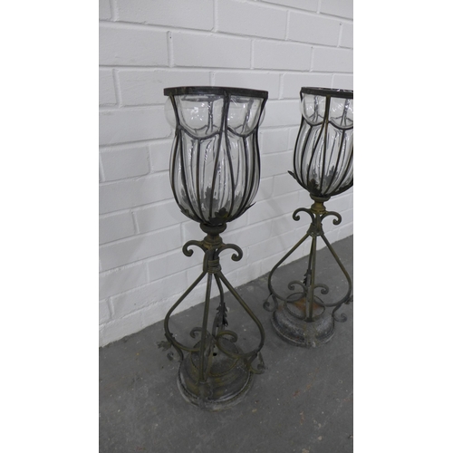 262 - Pair of glass and metal mounted urn storm lanterns, 65cm high. (2)