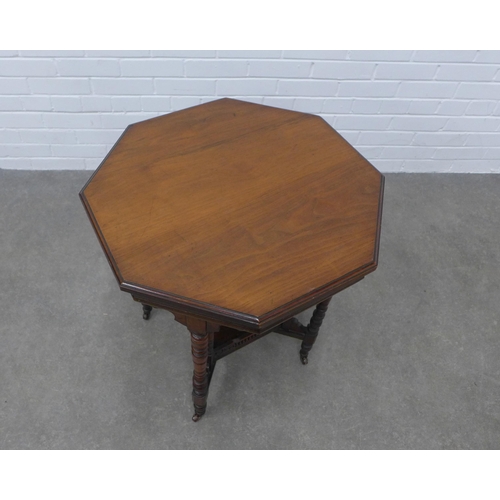 283 - Edwardian mahogany table with octagonal top, square undertier with fretwork sides, raised on ring tu... 