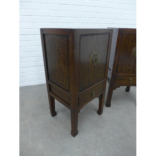 286 - Pair of Asian hardwood bedside cabinets, square tops with two doors with brass fittings, raised on s... 