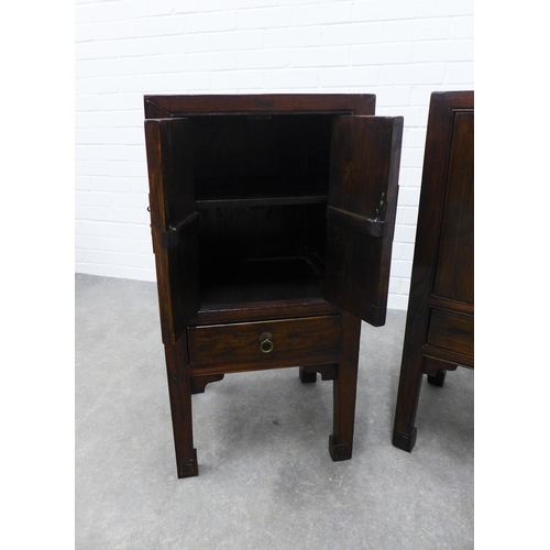 286 - Pair of Asian hardwood bedside cabinets, square tops with two doors with brass fittings, raised on s... 