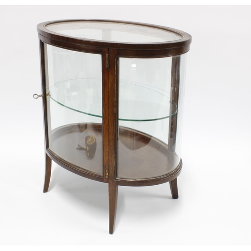 299 - Miniature mahogany oval vitrine cabinet, with glass sides and internal glass shelf, on tapering outs... 