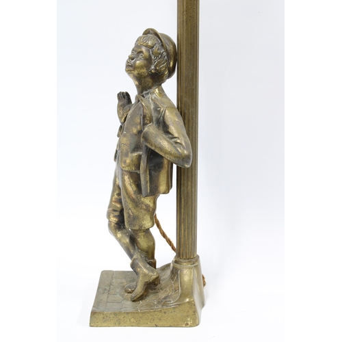 329 - Brass figural table lamp base with a boy standing beneath a lamp post with glass panelled lantern sh... 