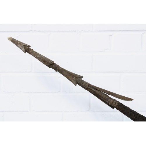 363 - Long barbed fishing spear, with twine decoration, probably South Seas, 256cm