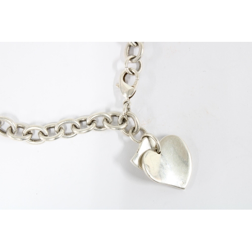 38 - Silver curb link necklace with two heart shaped pendants inscribed 'Tiffany & Co'