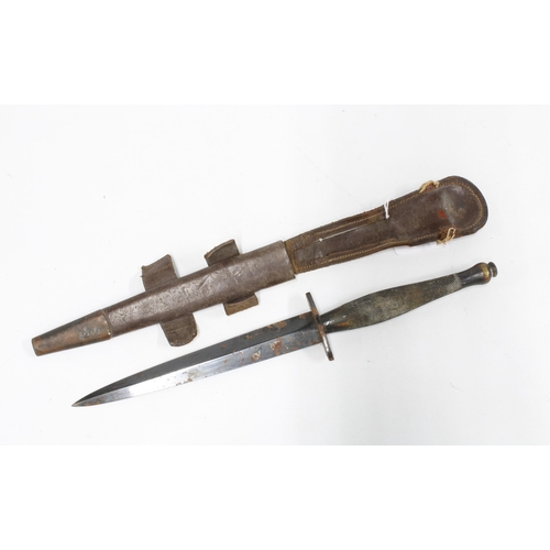 393 - Commando dagger / fighting knife with chequered hilt together with a metal mounted brown leather sca... 