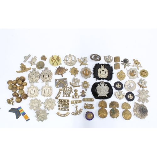 397 - Quantity of early 20th century military cap badges and buttons, etc (a lot)