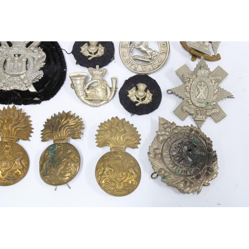 397 - Quantity of early 20th century military cap badges and buttons, etc (a lot)