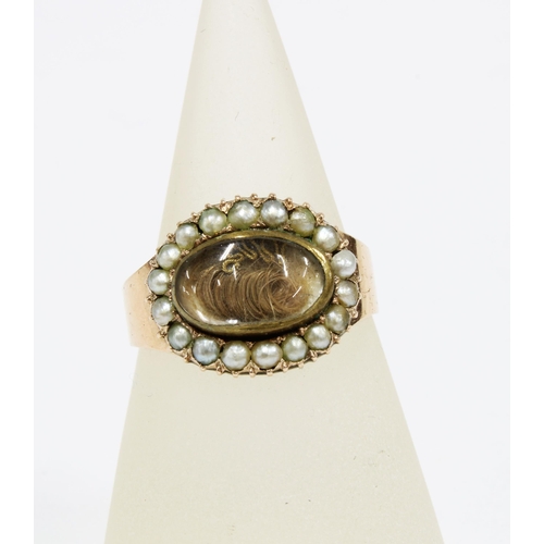 74 - 19th century gold and seed pearl mourning ring with glazed panel containing hair, the inner inscribe... 