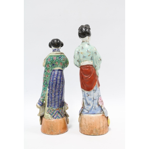 78 - Two Chinese polychrome enamelled female figures, taller 25cm (2)