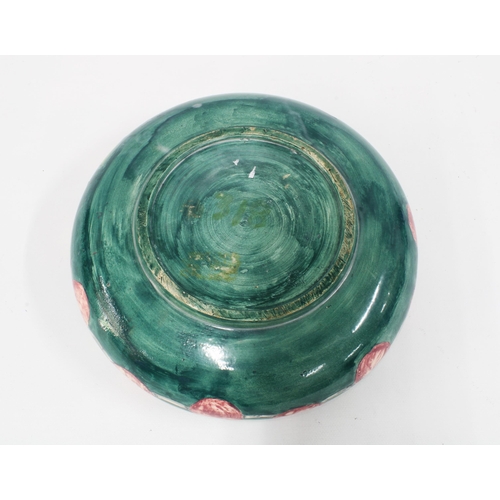 94 - Holyrood Pottery, early 20th century shallow bowl, green ground decorated with plums, impressed back... 