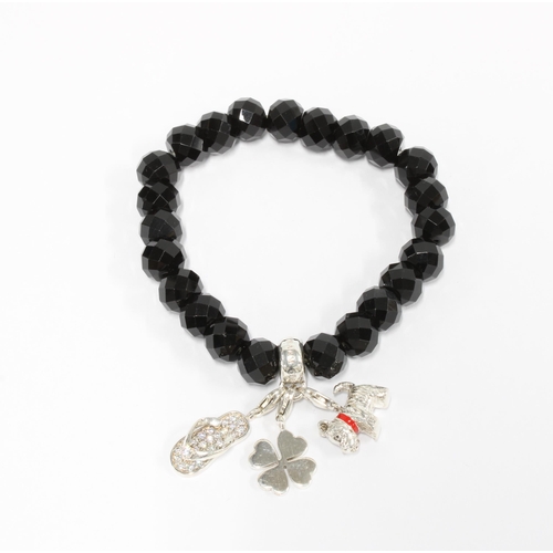 402 - Thomas Sabo black crystal bracelet with three silver charms