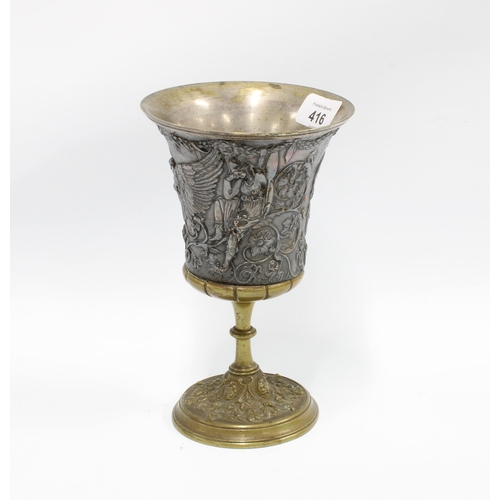 416 - Mixed metal goblet, the flared bowl with classical figures in relief on a knop stem with circular fo... 