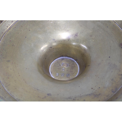 416 - Mixed metal goblet, the flared bowl with classical figures in relief on a knop stem with circular fo... 