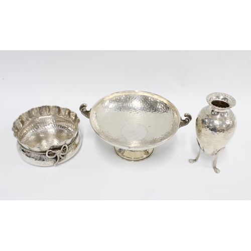 16 - A group of hammered silver items to include a comprt, dish with frilled edge and a vase on tripod le... 