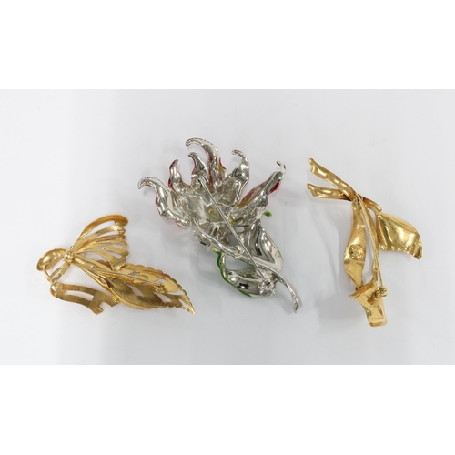 34 - Two yellow metal and pearl floral spray brooches, indistinctly marked, together with a costume jewel... 