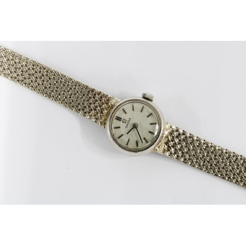 35 - Lady's vintage 9ct white gold Omega wrist watch on a 9ct gold bracelet strap, complete with box and ... 