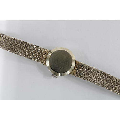 35 - Lady's vintage 9ct white gold Omega wrist watch on a 9ct gold bracelet strap, complete with box and ... 