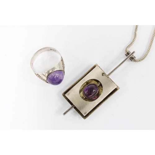 41 - 1970's silver and amethyst cabouchon pendant, London 1977, on a silver snake link chain, together wi... 
