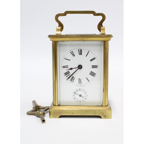 422 - French carriage clock of small proportions,  complete with key, 13cm high including handle