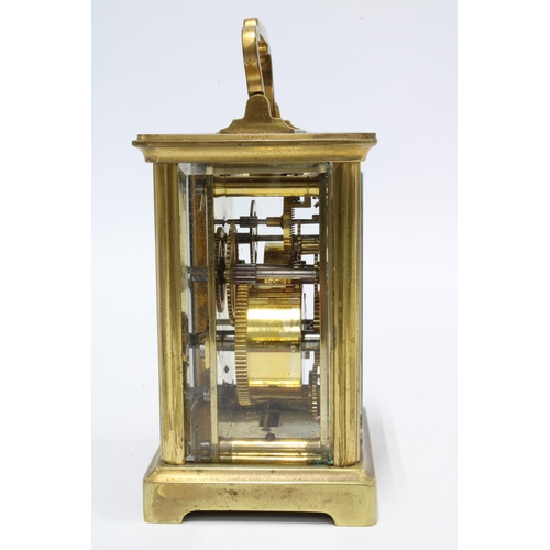 422 - French carriage clock of small proportions,  complete with key, 13cm high including handle