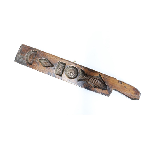 432 - Folk art carved wooden mould, perhaps for chocolate, 41cm long