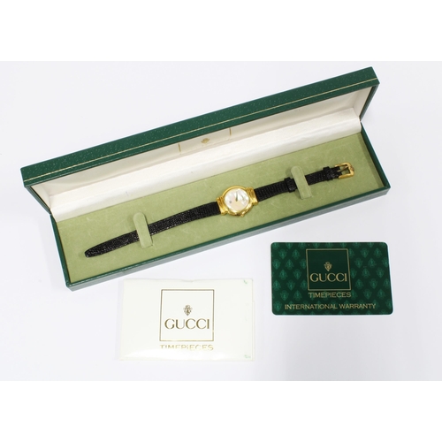 438 - Lady's Gucci wrist watch with mother of pearl dial, original box