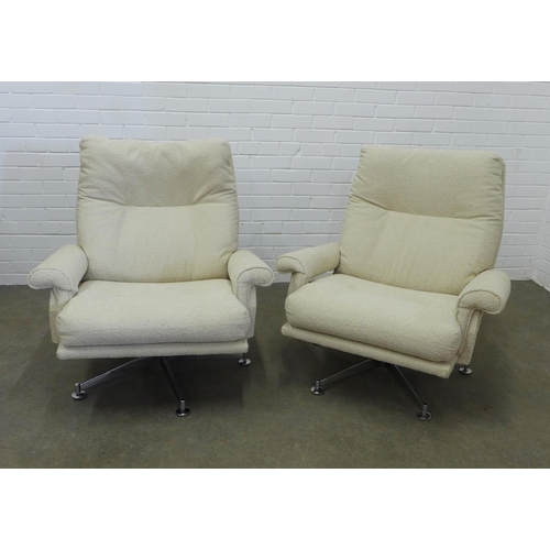 452 - A pair of mid-century lounge chairs, probably by Howard Keith, upholstered in cream boucle wool, chr... 